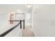 Bright upstairs hallway with black-and-white banister leading to carpeted bedrooms and tiled bathroom at 19428 E Crestridge Cir, Centennial, CO 80015