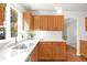 Kitchen with light wood cabinets, white countertop and stainless steel dishwasher at 19428 E Crestridge Cir, Centennial, CO 80015