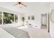 Bright main bedroom includes ceiling fan, neutral colors, and ensuite bath at 19428 E Crestridge Cir, Centennial, CO 80015