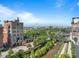 Scenic aerial view features a brick building near a bridge with views of city skyline and green spaces at 1628 14Th St # 6A, Denver, CO 80202
