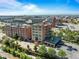 Expansive aerial view showcasing the brick building's urban location with surrounding city skyline and parking at 1628 14Th St # 6A, Denver, CO 80202