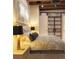 Well-lit bedroom features neutral tones, stylish lamps, and a comfortable bed with accent pillows at 1628 14Th St # 6A, Denver, CO 80202