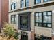 Close-up of the building's facade with architectural details, large windows, and a charming balcony at 1628 14Th St # 6A, Denver, CO 80202