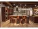 Gourmet kitchen featuring a large island, wood cabinets and stainless steel appliances at 1628 14Th St # 6A, Denver, CO 80202
