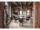 Bright living room boasts wood beams, brick walls, hardwood floors, and modern decor at 1628 14Th St # 6A, Denver, CO 80202