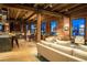 Open-concept living space featuring exposed brick, wood beams and modern furnishings at 1628 14Th St # 6A, Denver, CO 80202