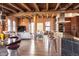 Spacious living room with exposed beams, brick walls and open concept design at 1628 14Th St # 6A, Denver, CO 80202
