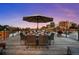 Expansive rooftop patio features dining and lounging areas against a beautiful city skyline backdrop at 1628 14Th St # 6A, Denver, CO 80202