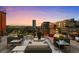 Rooftop patio with outdoor seating and skyline views at 1628 14Th St # 6A, Denver, CO 80202