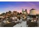 Beautiful rooftop deck with comfortable seating, vibrant flowerpots, and amazing views of the city at 1628 14Th St # 6A, Denver, CO 80202