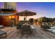 Rooftop terrace with dining and lounge area with a view of the city skyline at sunset at 1628 14Th St # 6A, Denver, CO 80202