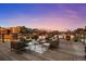 Spacious rooftop deck featuring various seating arrangements and stunning views of the city skyline at 1628 14Th St # 6A, Denver, CO 80202
