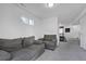 Finished basement featuring neutral paint and carpet with gray seating at 16347 E 111Th Dr, Commerce City, CO 80022