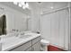 Bathroom featuring a vanity with a sink and shower with a curtain at 16347 E 111Th Dr, Commerce City, CO 80022