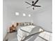 Bright bedroom featuring a ceiling fan, three modern windows, and neutral decor at 16347 E 111Th Dr, Commerce City, CO 80022