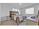 Bedroom with industrial style wooden headboard and neutral colored decor at 16347 E 111Th Dr, Commerce City, CO 80022