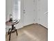 Bright entryway featuring wood floors, white trim, and a stylish side table with a lamp at 16347 E 111Th Dr, Commerce City, CO 80022
