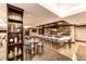 Upscale bar area with stylish seating and an extensive selection of spirits on display at 23590 E Jamison Pl, Aurora, CO 80016