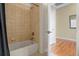 Bright bathroom features a tiled shower-tub combo and neutral color palette at 23590 E Jamison Pl, Aurora, CO 80016