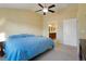 Spacious primary bedroom featuring a ceiling fan, ensuite bathroom and neutral decor at 23590 E Jamison Pl, Aurora, CO 80016