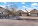 Home exterior featuring a spacious driveway and well-maintained landscaping at 23590 E Jamison Pl, Aurora, CO 80016