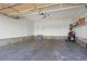 Spacious two-car garage offers ample storage space for vehicles and equipment at 23590 E Jamison Pl, Aurora, CO 80016