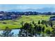 Enjoy breathtaking views of the golf course, pond, and distant mountains at 23590 E Jamison Pl, Aurora, CO 80016