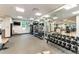 Bright gym with weights, training equipment, and mirrors for a complete workout at 23590 E Jamison Pl, Aurora, CO 80016