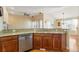 Open kitchen with granite countertops, stainless steel appliances, and hardwood floors at 23590 E Jamison Pl, Aurora, CO 80016