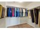 Well-organized walk-in closet with shelving and hanging space for clothes and accessories at 23590 E Jamison Pl, Aurora, CO 80016