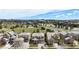 Aerial view of a neighborhood with mature trees, green space and community pool at 7004 S Addison Ct, Aurora, CO 80016