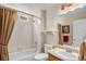 Clean bathroom with a shower and tub combination, tile, and vanity at 7004 S Addison Ct, Aurora, CO 80016
