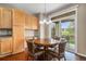 Breakfast nook with wood floors, lighting fixture and sliding doors leading to the outside patio at 7004 S Addison Ct, Aurora, CO 80016