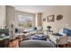 Inviting living room featuring hardwood floors, comfortable seating, and natural light at 7004 S Addison Ct, Aurora, CO 80016