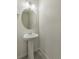 Stylish powder room featuring a pedestal sink and modern fixtures in a well lit area at 8388 E 132Nd Pl, Thornton, CO 80602