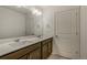 Modern bathroom featuring double sinks, neutral walls, chrome hardware, and a contemporary vanity at 8388 E 132Nd Pl, Thornton, CO 80602
