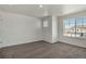 Bedroom featuring neutral walls and carpet, with windows offering views, and electrical outlets at 8388 E 132Nd Pl, Thornton, CO 80602