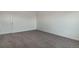 Carpeted bedroom offers a tranquil space with ample natural light and simple design at 8388 E 132Nd Pl, Thornton, CO 80602