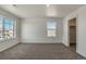 Bedroom featuring neutral walls and carpet, offering a bright area for relaxing, with closet at 8388 E 132Nd Pl, Thornton, CO 80602