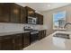 Well-lit kitchen with sleek appliances and stylish countertop with a backsplash at 8388 E 132Nd Pl, Thornton, CO 80602