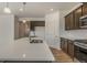 Open concept kitchen with a large island and stainless steel sink at 8388 E 132Nd Pl, Thornton, CO 80602