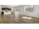 Spacious open floor plan with sleek kitchen and adjacent living area with lots of windows at 8388 E 132Nd Pl, Thornton, CO 80602