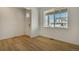 Bright room with wood-look flooring and natural light at 8388 E 132Nd Pl, Thornton, CO 80602
