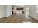 Expansive living space featuring an open floor plan connecting the living room and kitchen at 8388 E 132Nd Pl, Thornton, CO 80602