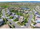Aerial view showcasing neighborhood with ponds and walking trails and homes with trees and lawns at 16069 Pikes Peak Dr, Broomfield, CO 80023