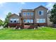 Expansive backyard with a well-manicured lawn and large windows offering stunning views of the surrounding landscape at 16069 Pikes Peak Dr, Broomfield, CO 80023
