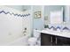 Charming bathroom featuring a tiled tub, modern vanity, and stylish decor, offering a comfortable space at 16069 Pikes Peak Dr, Broomfield, CO 80023