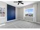 Spacious bedroom with a large window, neutral paint, and ceiling fan, creating a relaxing retreat at 16069 Pikes Peak Dr, Broomfield, CO 80023
