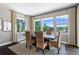 Formal dining room features large windows overlooking backyard and stylish decor at 16069 Pikes Peak Dr, Broomfield, CO 80023