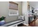 Welcoming foyer with bench seat, window and kitchen access at 16069 Pikes Peak Dr, Broomfield, CO 80023